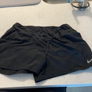 Black Nike running shorts